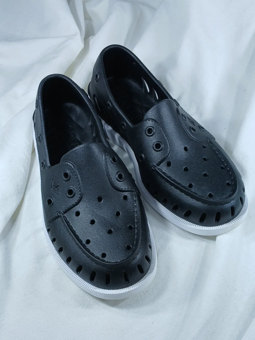 Sperry Black Perforated Slip-On Boat Shoes with White Sole
